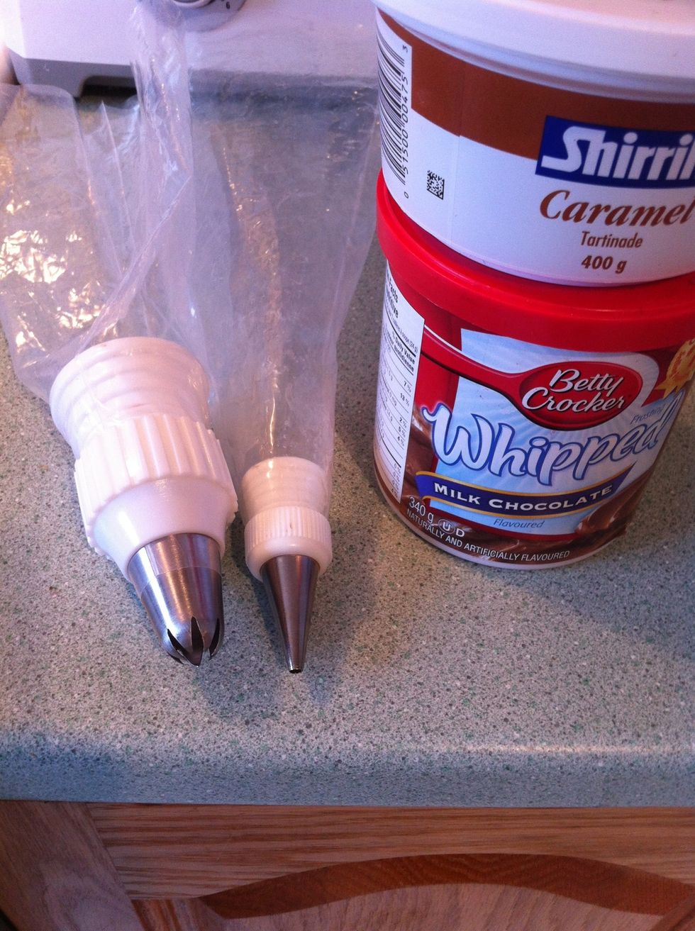 After cupcakes have completely cooled, ice using store bought or home made icing. In the interest of time, today I am using store bought whipped chocolate icing!