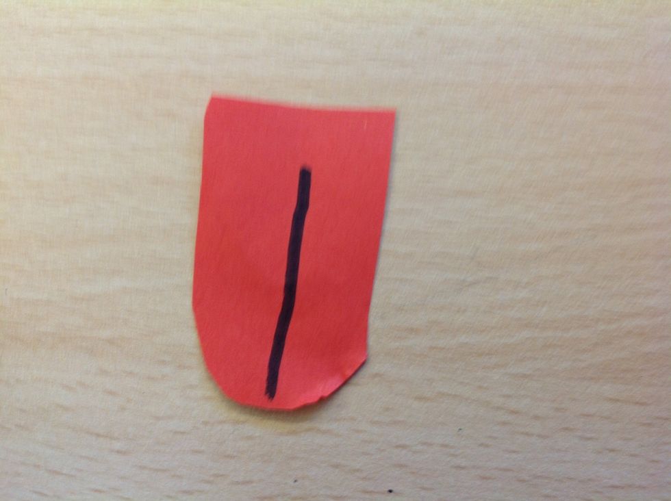 After cut out a tongue from the red paper and add a black line.