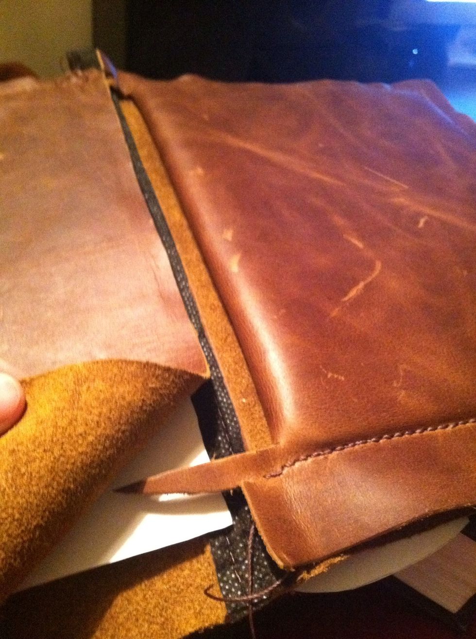 After cutting the flap, there's some extra leather. I will sew this into the spine just to tighten things up.