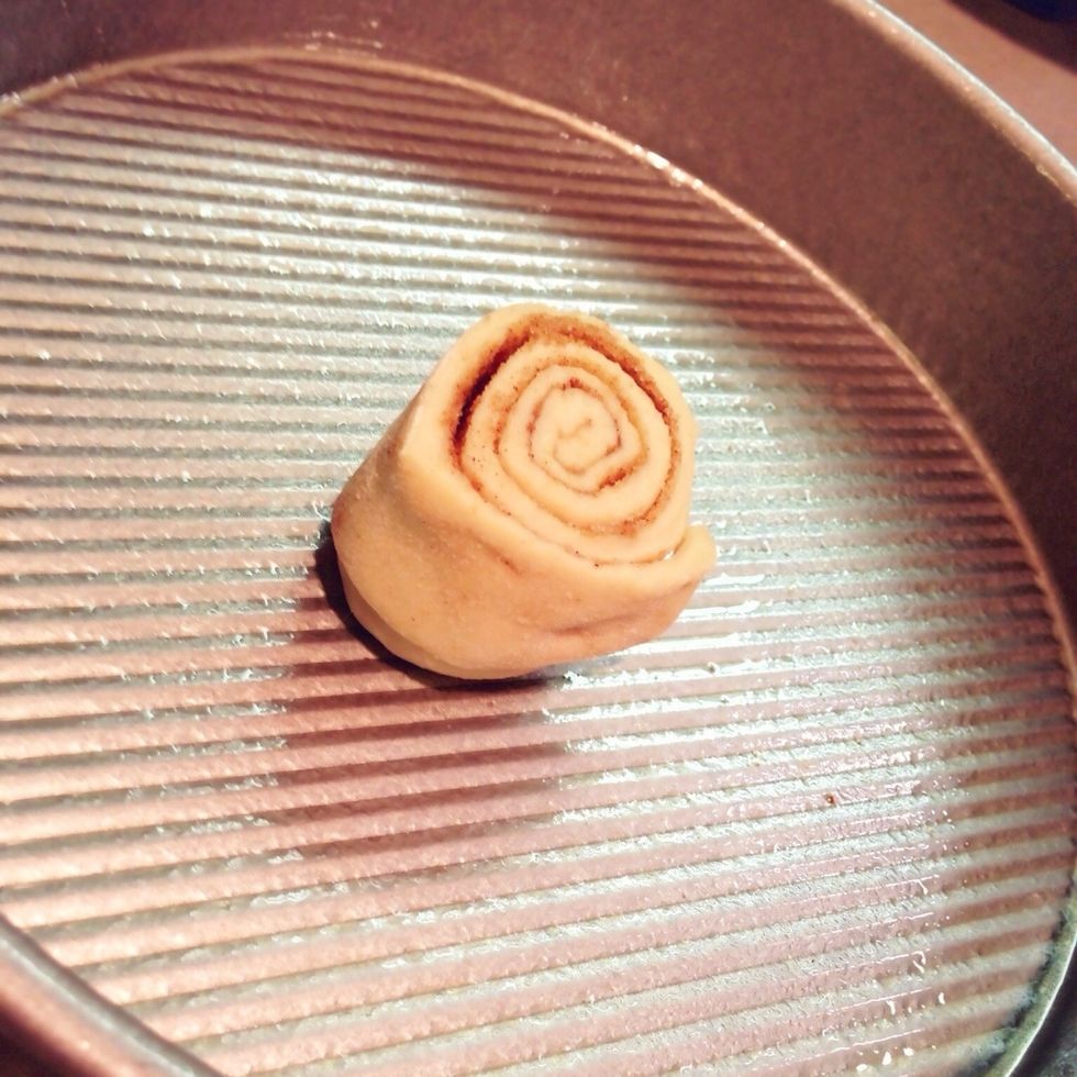 After cutting the rolls, place in greased pans.