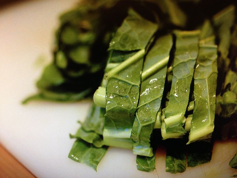 After de-stemming and washing, stack all greens flat on top of one another and slice to your desired thickness. Place to the side.