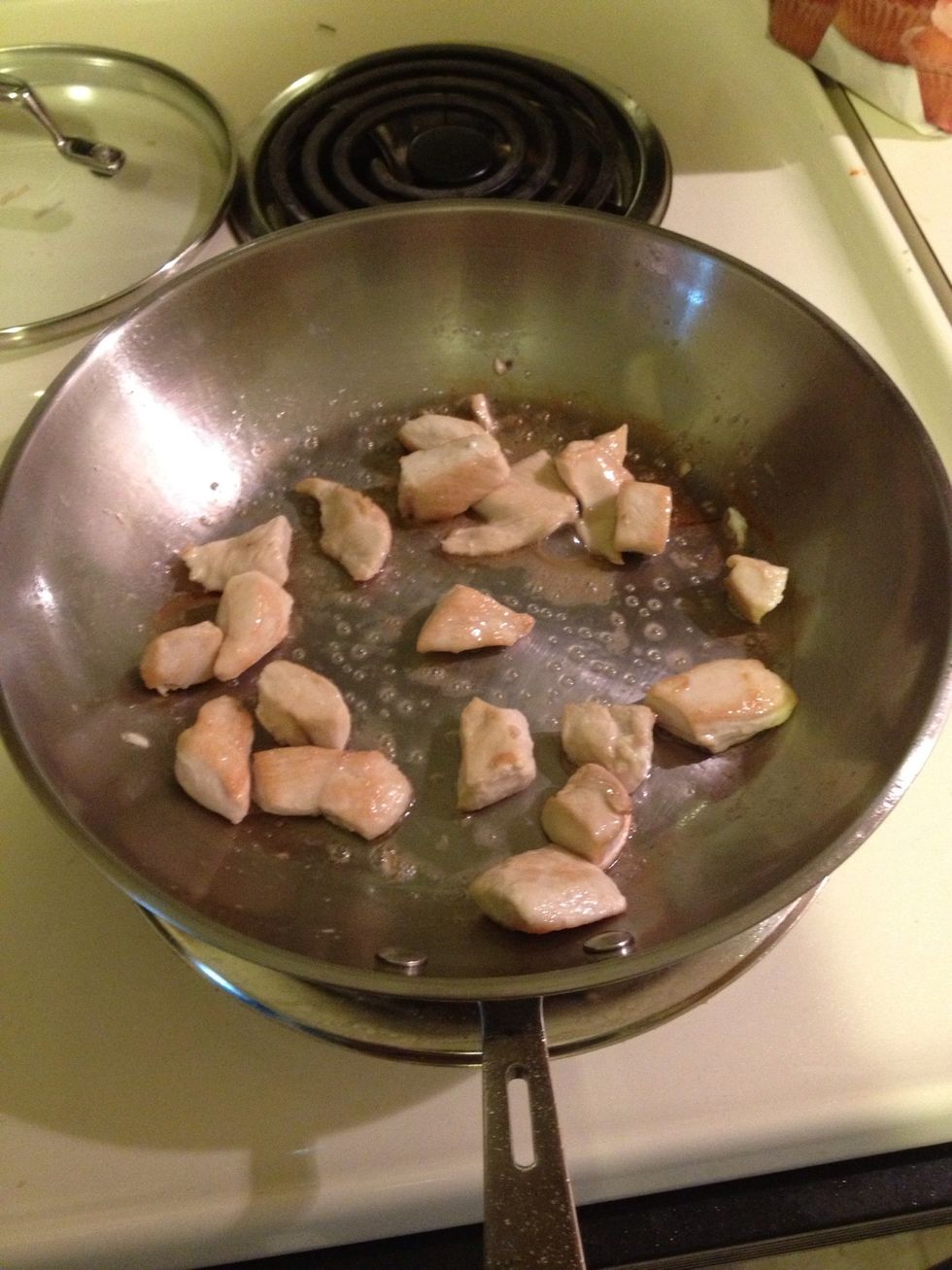 After dicing the chicken breast, start to cook the chicken.