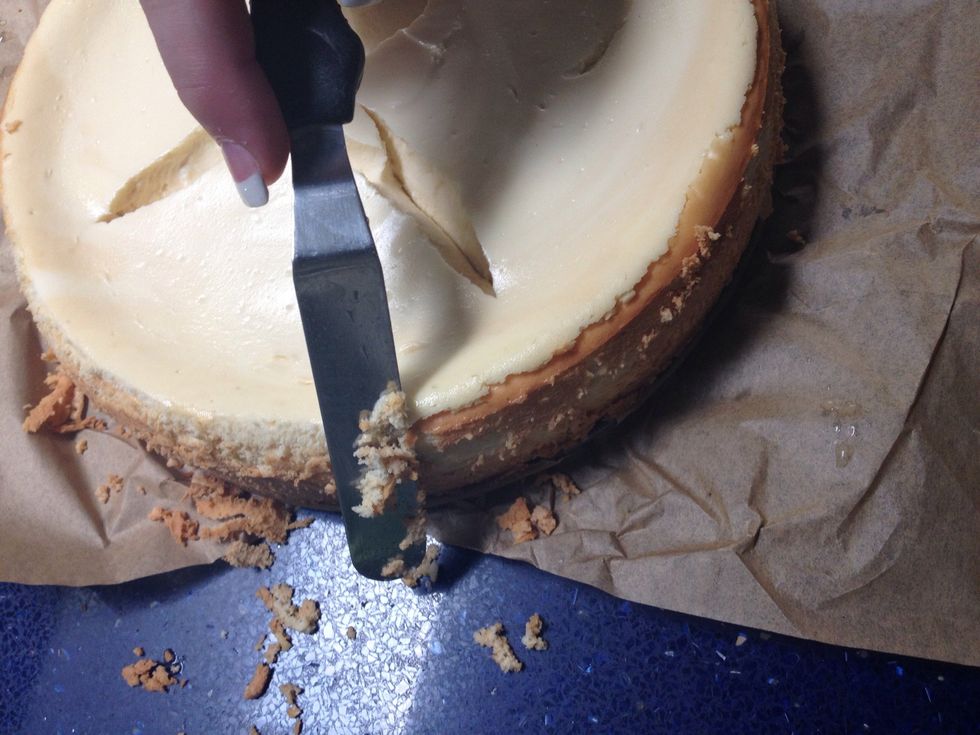 After dipping it in the boiling water, carefully scrape off any especially brown areas\u2026 This is not burnt necessarily, but the cake will look better without them.