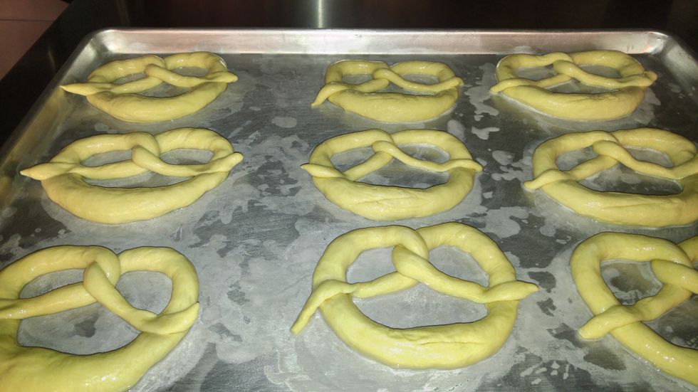 After dipping, lay them out on a sprayed sheet pan and make a slash across the thick center. Salt if desired and place on the center racks in the combi.