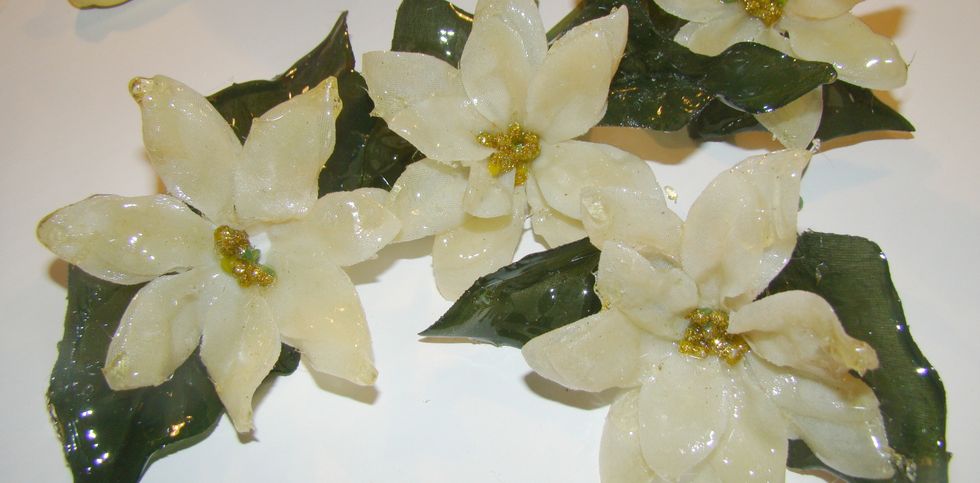 After dipping, lay your flowers and leaves on a craft mat or you can use their stems and stick them in a styrofoam block and allow to dry. They will dry quickly.