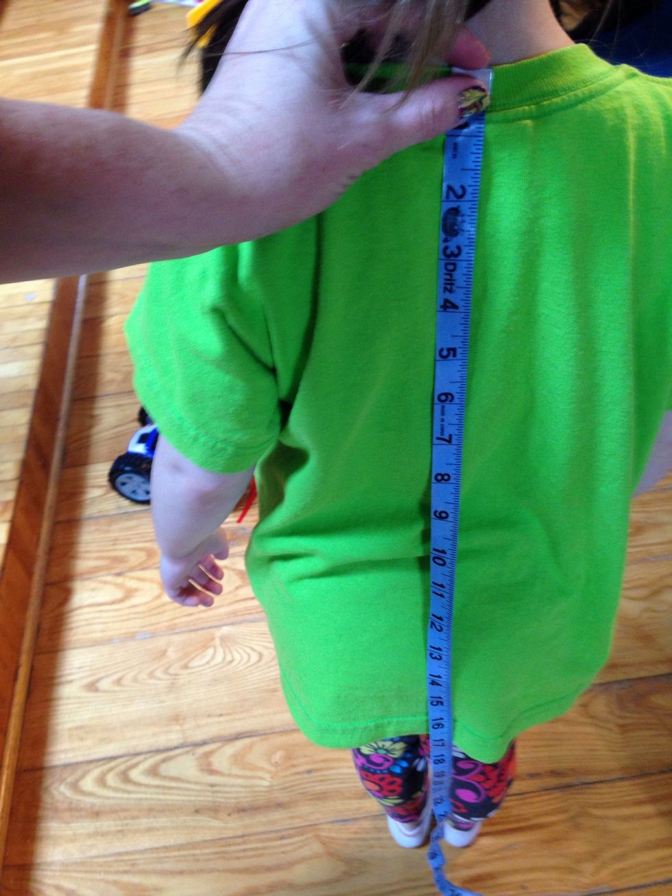 After dividing by 2 I checked to see how far down her back that would be then added 5 inches.