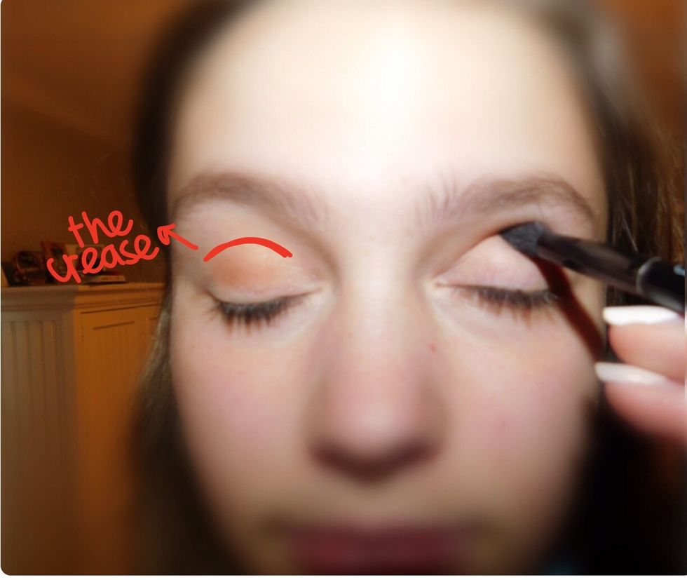 After enough of the crease color, take a color similar to the crease color, usually a bit darker. Put a little on the brush and blend it into the crease