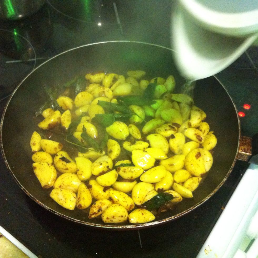 After few minutes add some hot water to the garlic (just a little don't add much)