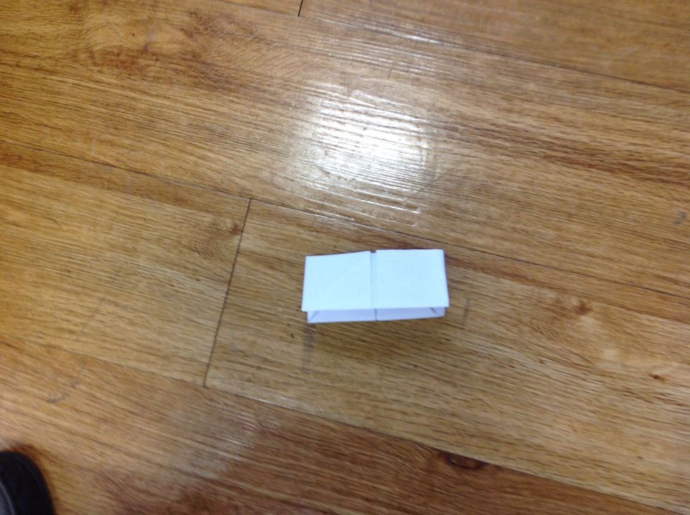 After,fold the paper in half.