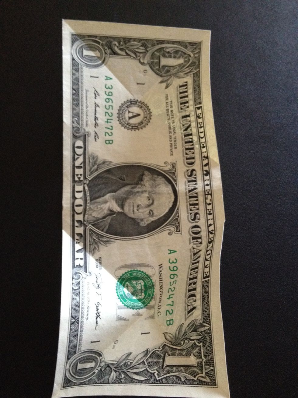 After folding the four corners. Notice how the bill has the marks of those folds.