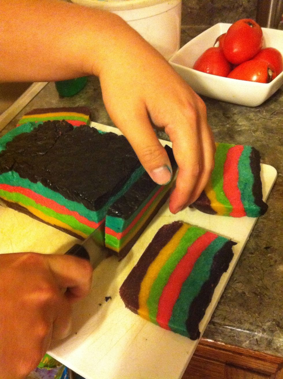 After FREEZING the dough for about an hour to solidify it into a loaf, cut out your cookies. Remember, each Pinata Cookie needs one thick slice (for the middle) and two thinner slices for sides!
