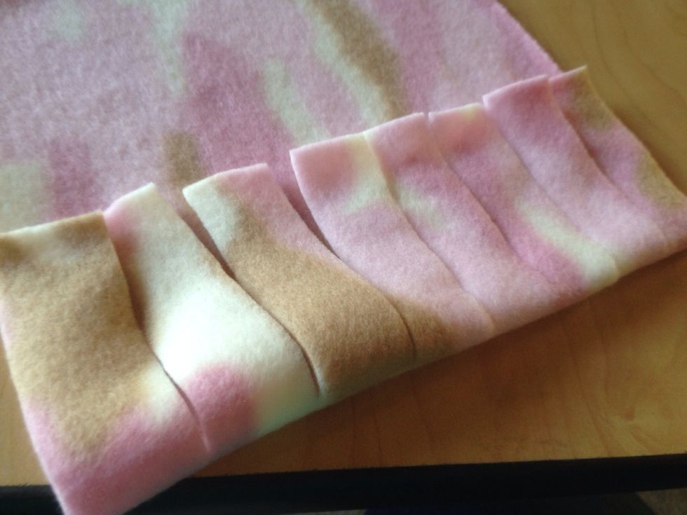 After fringe is cut, fold fringe up....