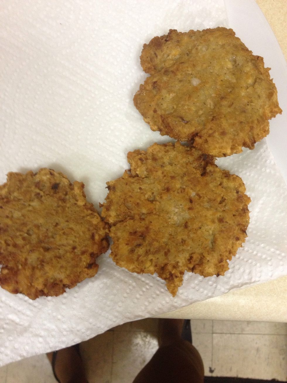 After fully cooking, allow the salmon patties to drain excess oil by placing them on some paper towels.