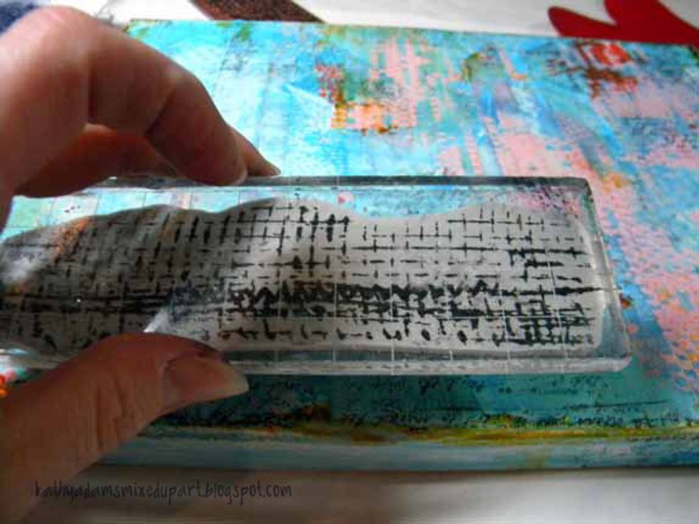 After getting over the excitement of my a-ha moment, I stamped the Stampendous N Studio \u201cMish Mesh\u201d stamp set and a script stamp in black ink randomly onto the canvas.