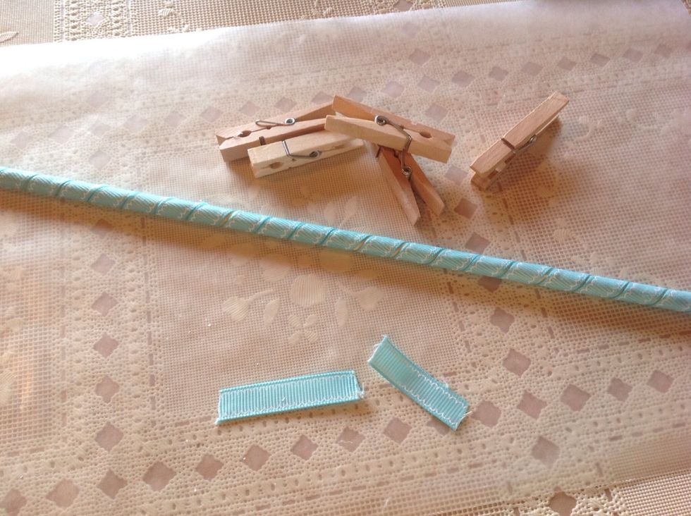 After glue is completely dry, remove clothes pins. Cut two pieces ribbon about 1 1/2 inches long. These will make a finished cover for both ends of dowel.