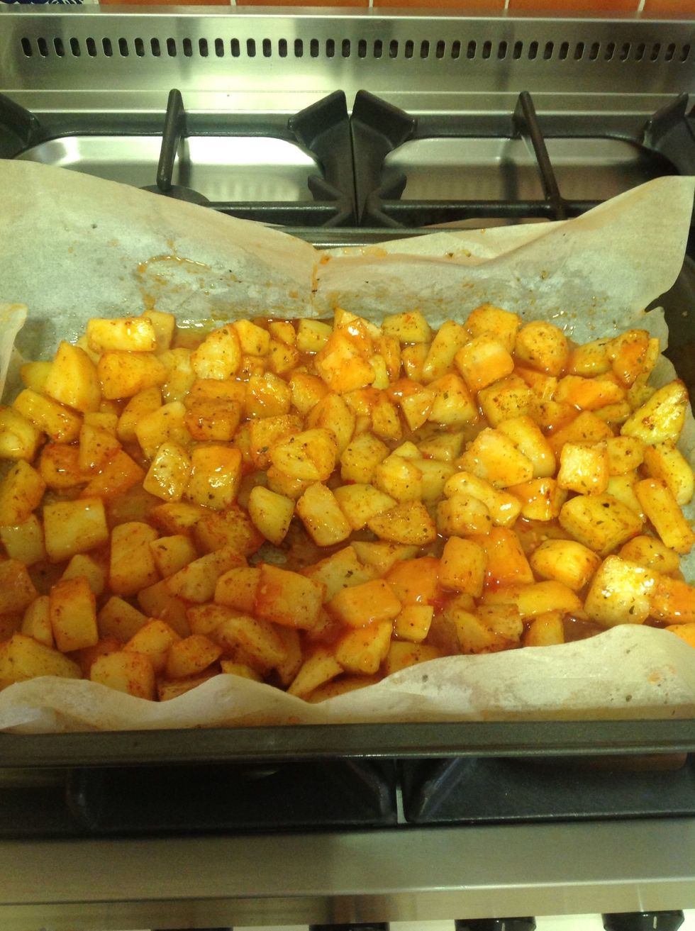 After half an hour in the oven, try one. It should be almost ready. Soft and nice color. Add about 2 cups of chili sauce and mix together. Put them back to the oven for 10 minutes