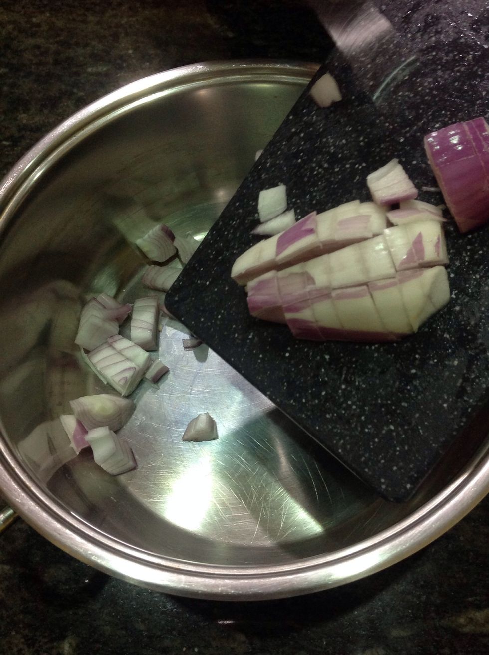 After heating the pan, put the onion in the pan.