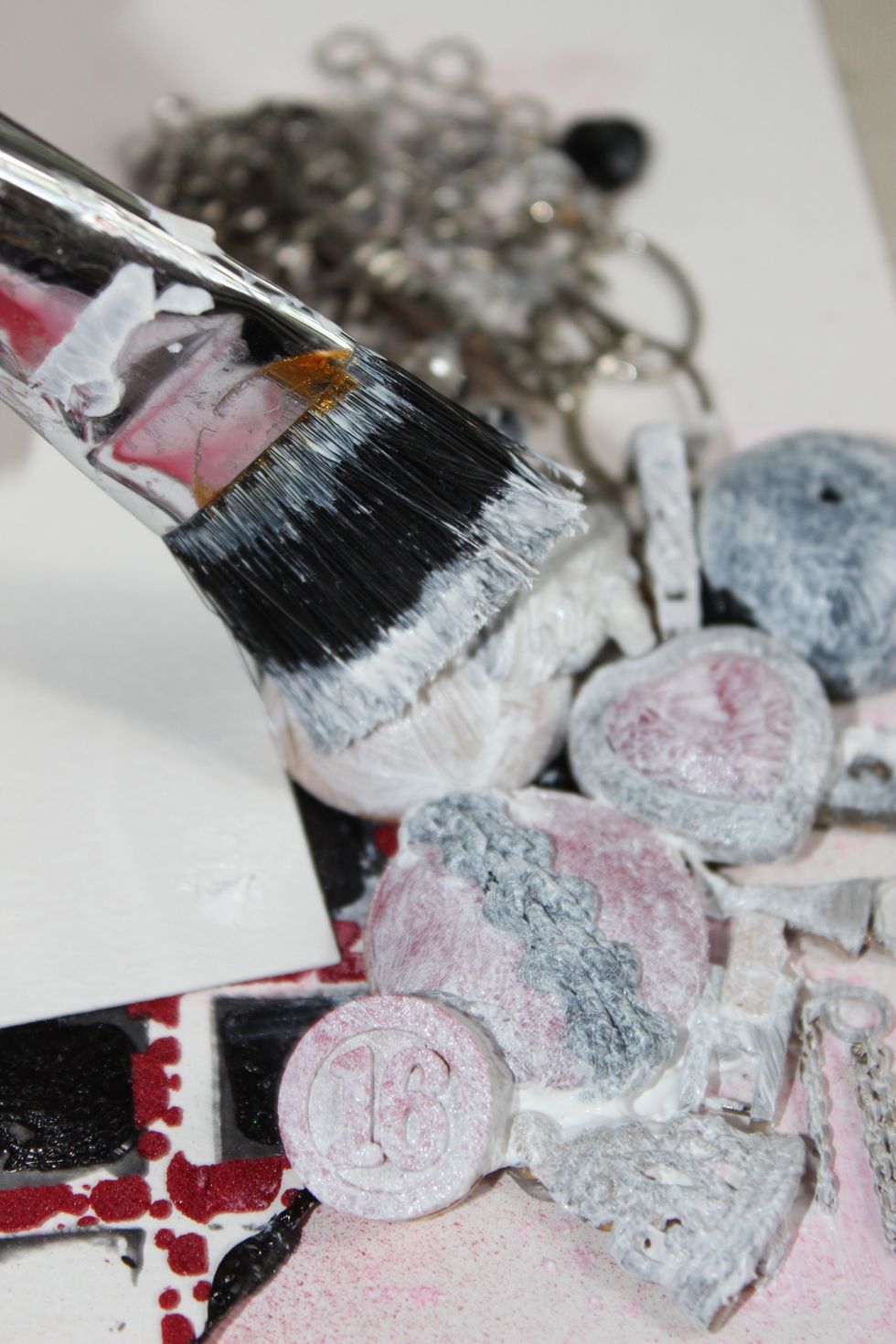 After hot gluing all the pieces to the layout, I went over them with Gesso.