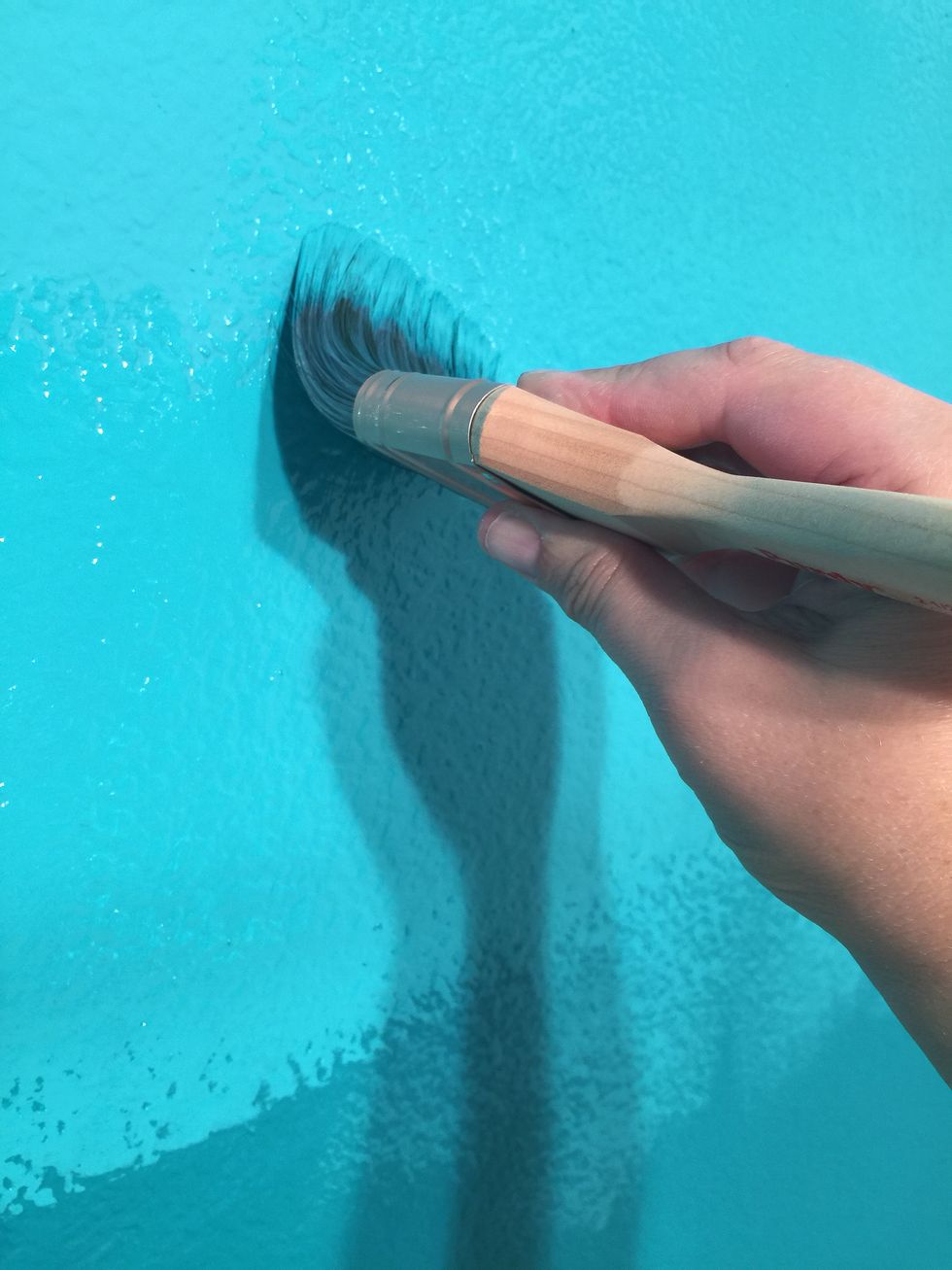 After I painted that small section, I used a dry brush to blend the new paint color up and down. This spreads the wet paint into the other two painted sections.