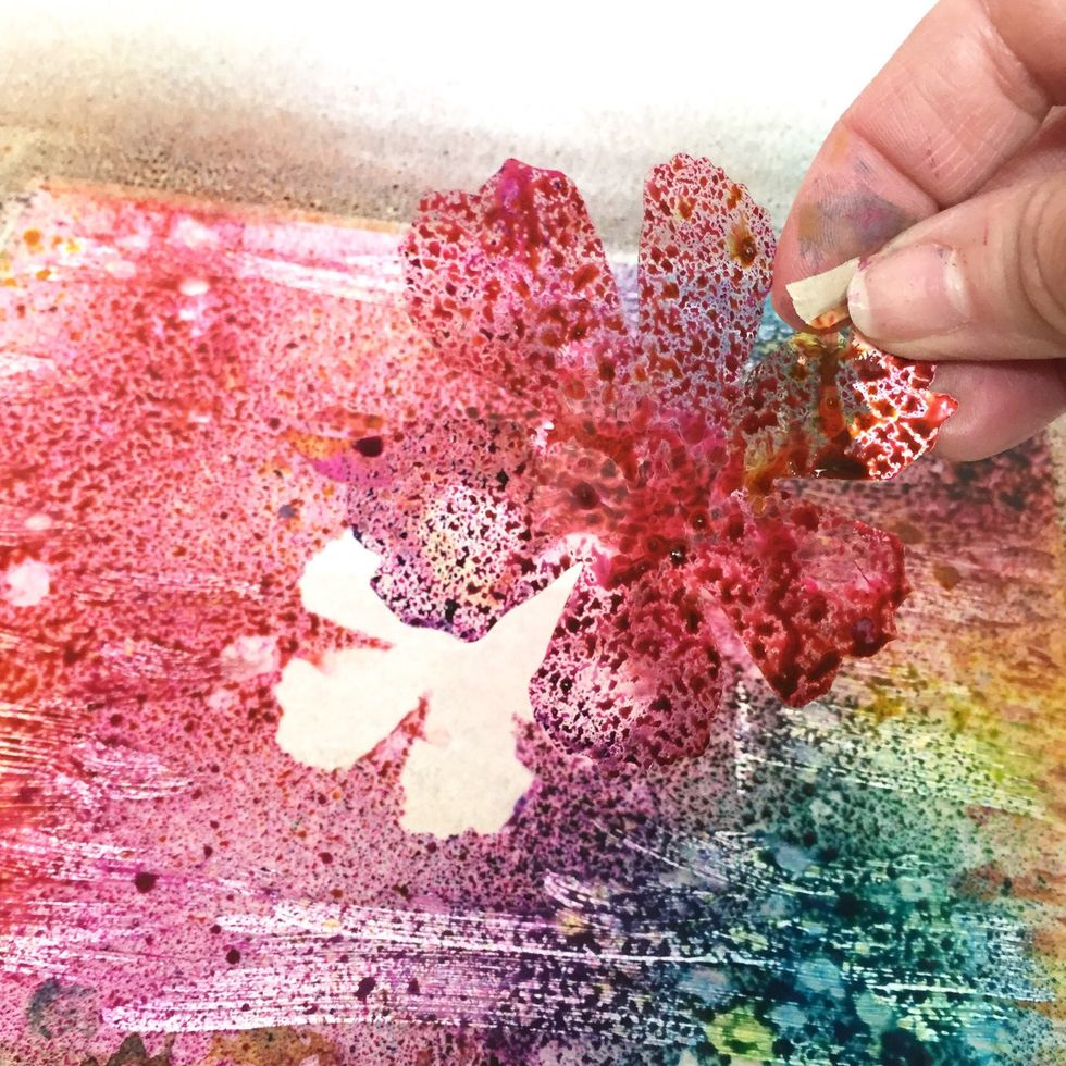 after i spritzed the plate with inks, i carefully removed the flowers. set them aside carefully, as we'll use them in another print.