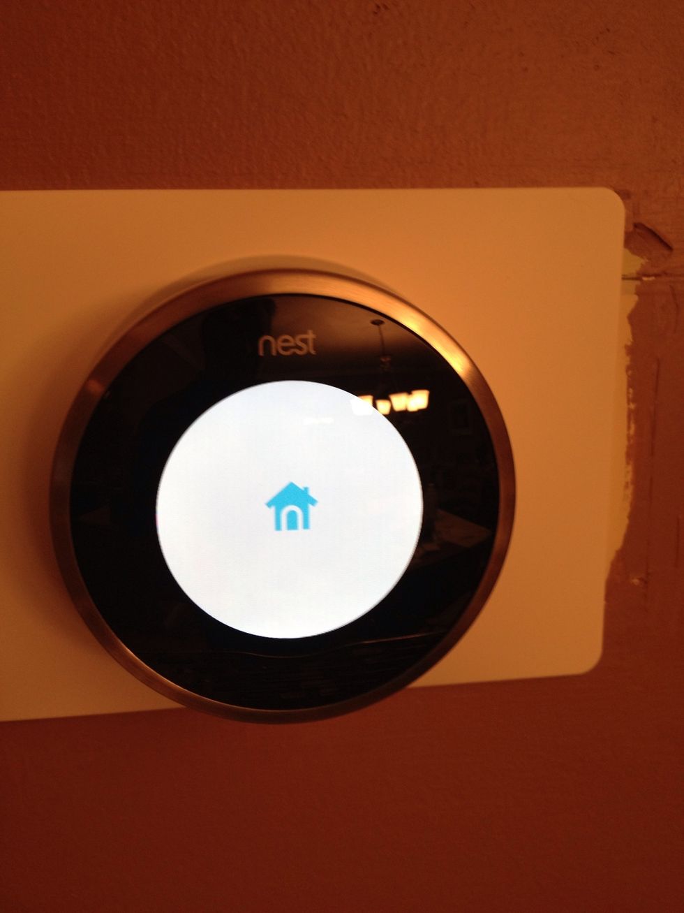After installed, place the face on and turn your power back on. Nest starts up immediately.