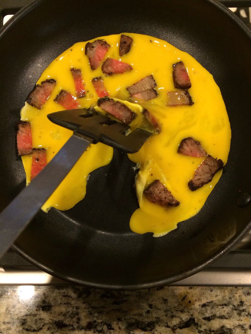 After it cooks for a little, start moving the edges inside