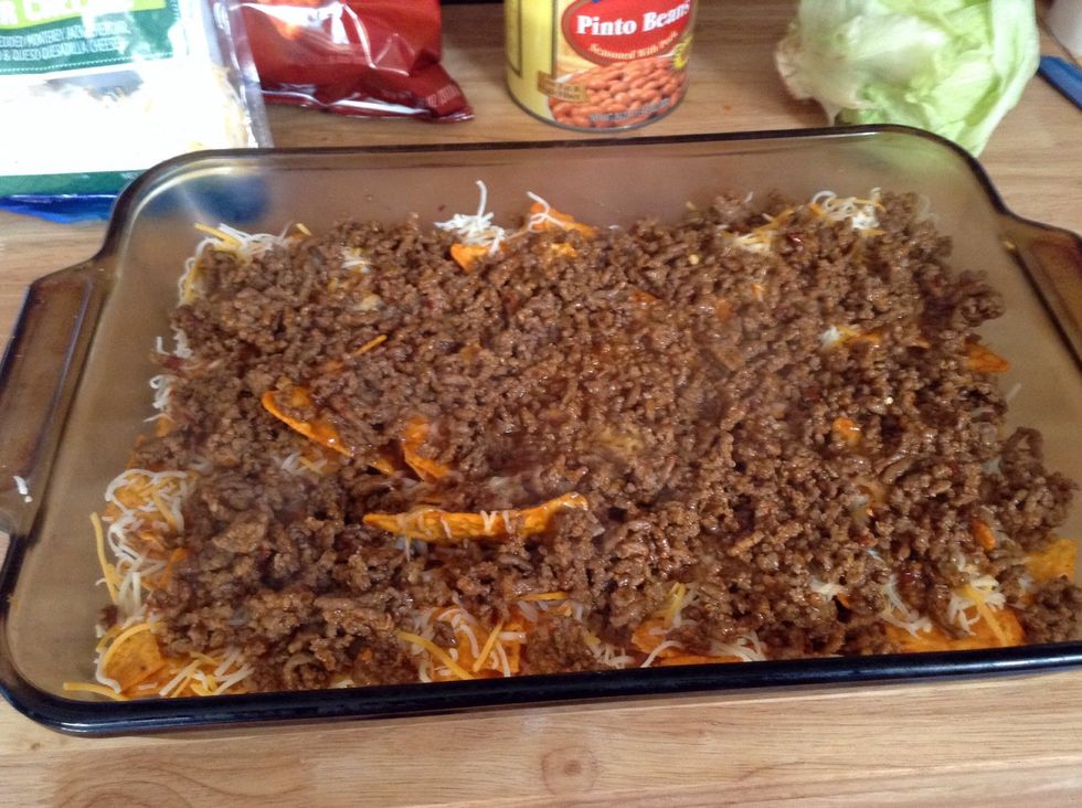 After it's cooked spread evenly over Doritos