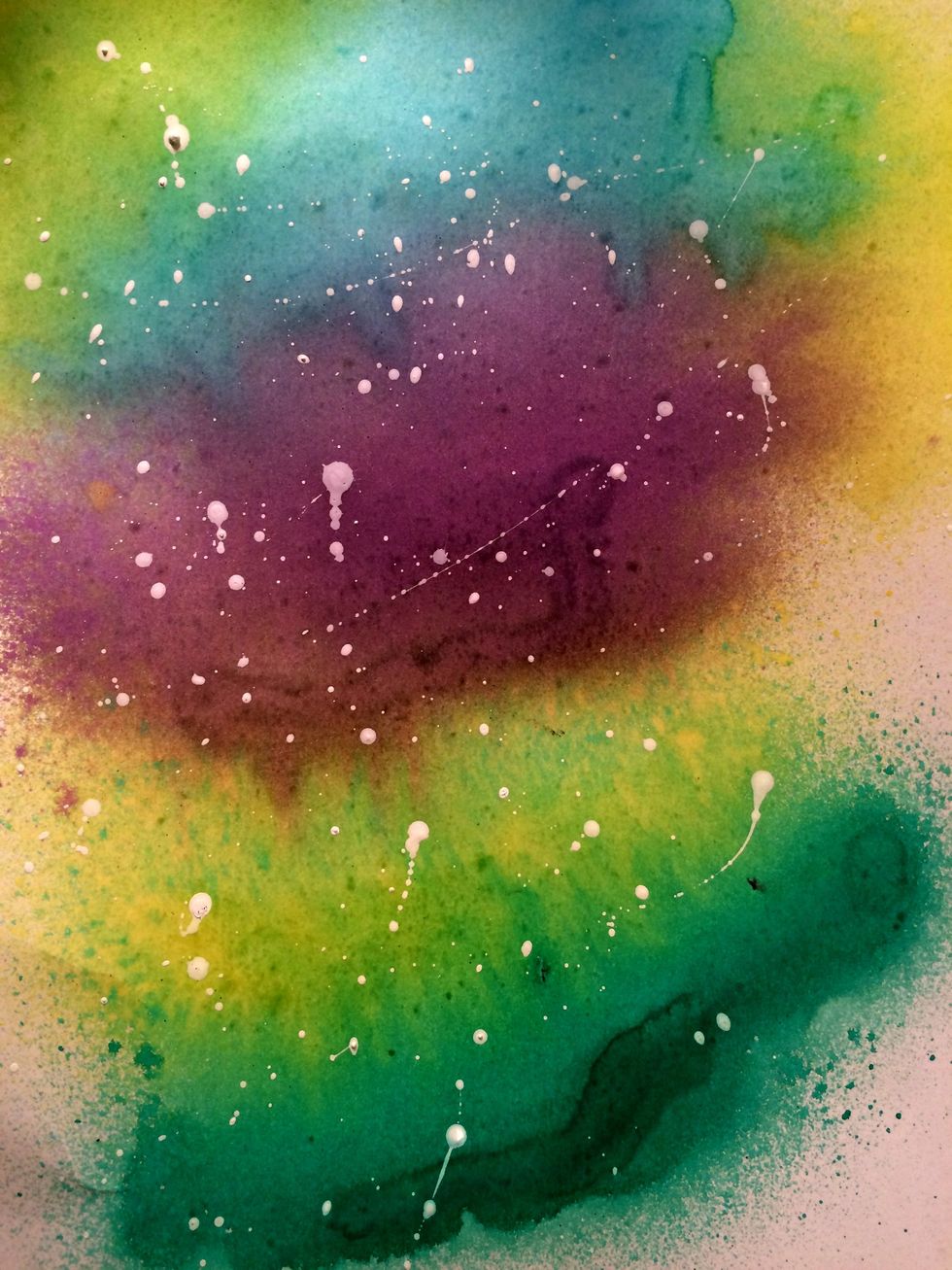 After it's dry, grab your white ink, and using the dropper just fling some white ink on the cardstock you just misted with color. After this dries, spray the entire piece with Art Anthology Gold spray