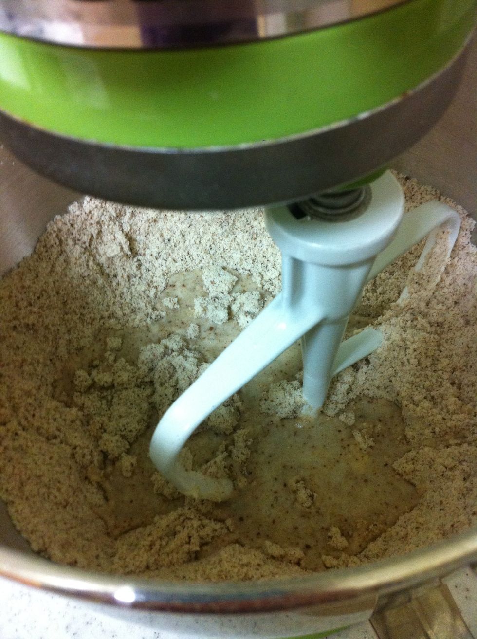 After its mixed together, add the warm water and mix again until it forms a ball