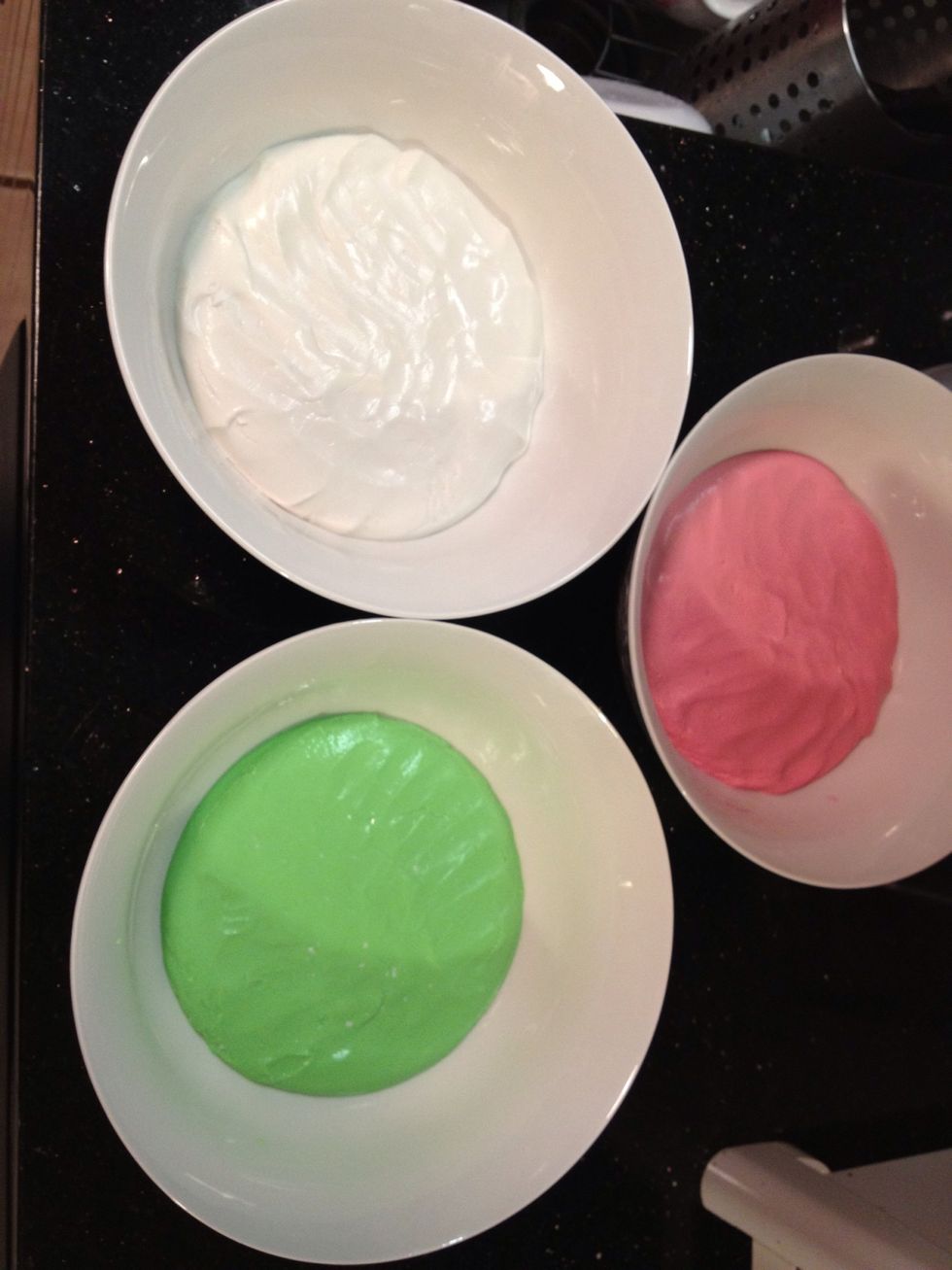After kneading - split the dough into 3 seperate containers and add your food colors (my red turned to pink and i just use 5 drops) knead it some more until the flour stop sticking to the bowl
