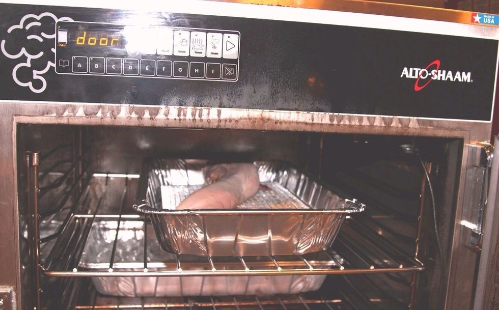 After loading the wood chips into the oven,place a pan above to capture the heat, then put the tongue into the Shaam smoker