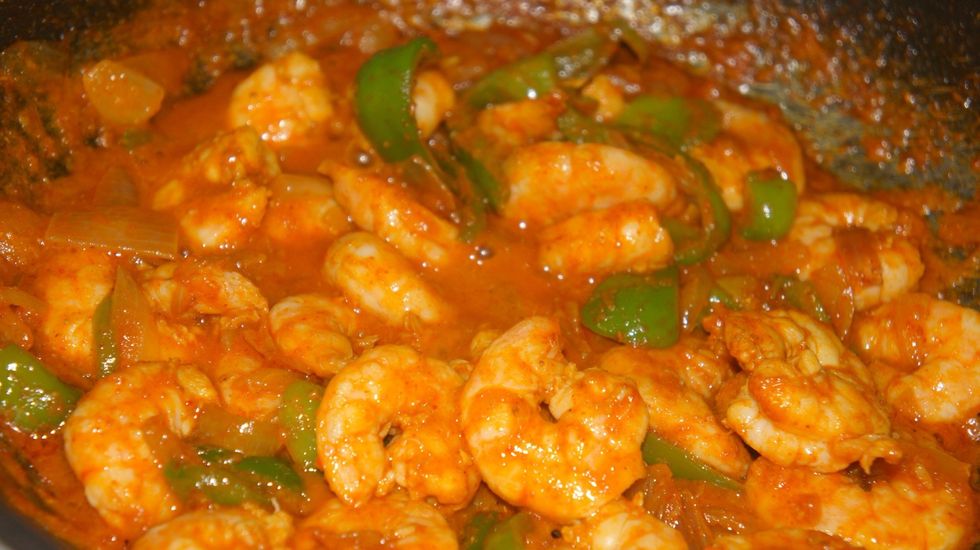 After marinade for 1 hr cook the shrimps with chopped onions and capsicum for 3 min