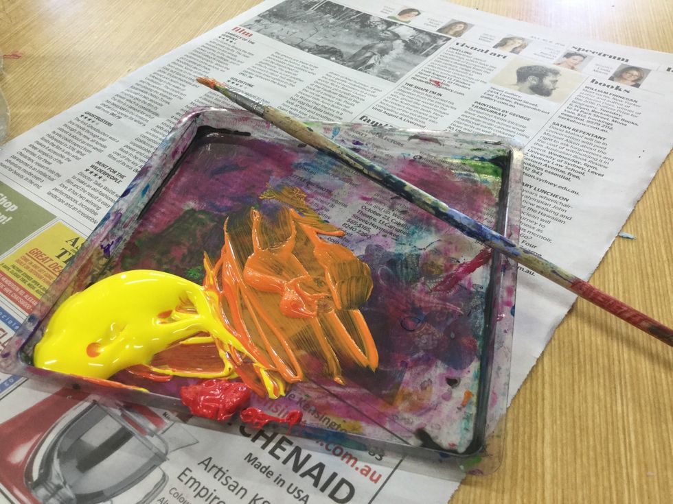 After marking out your desired sand or beach, mix yellow and red together to make the perfect sand like colour. You can chose whatever type of yellow/orange colour you like.It's up to you.