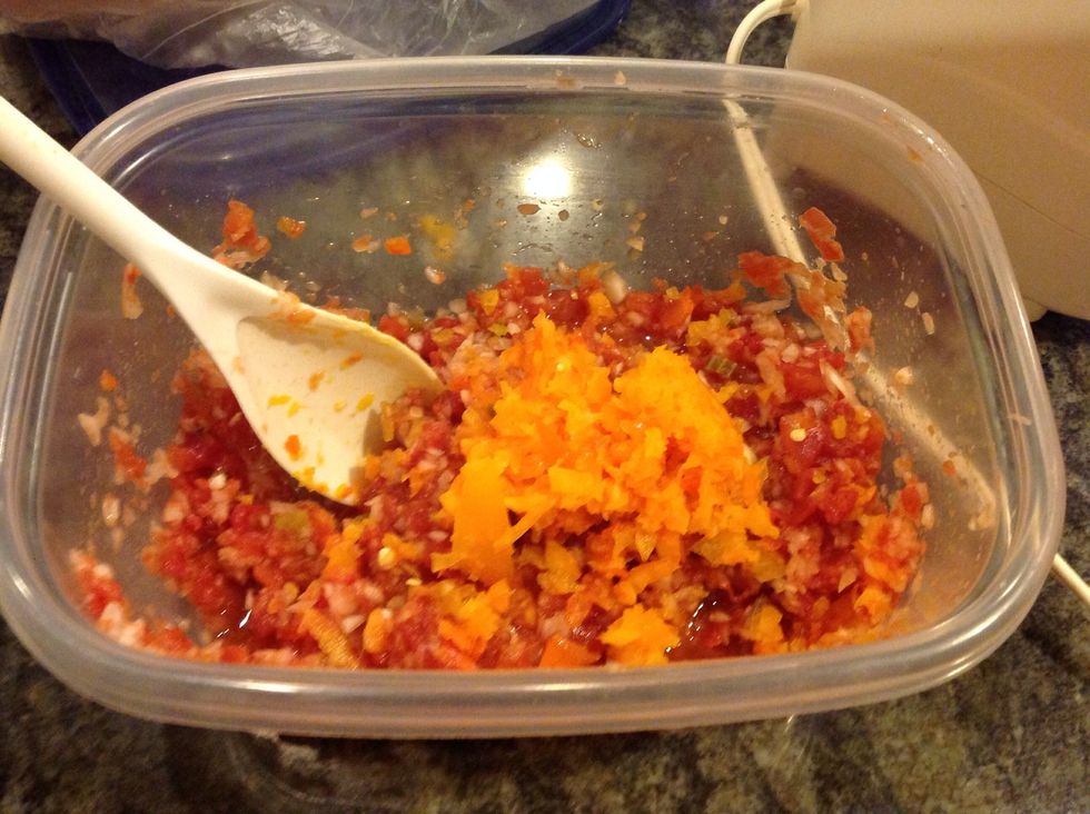 After mincing your first bell pepper add it to your tomatoes and onions.