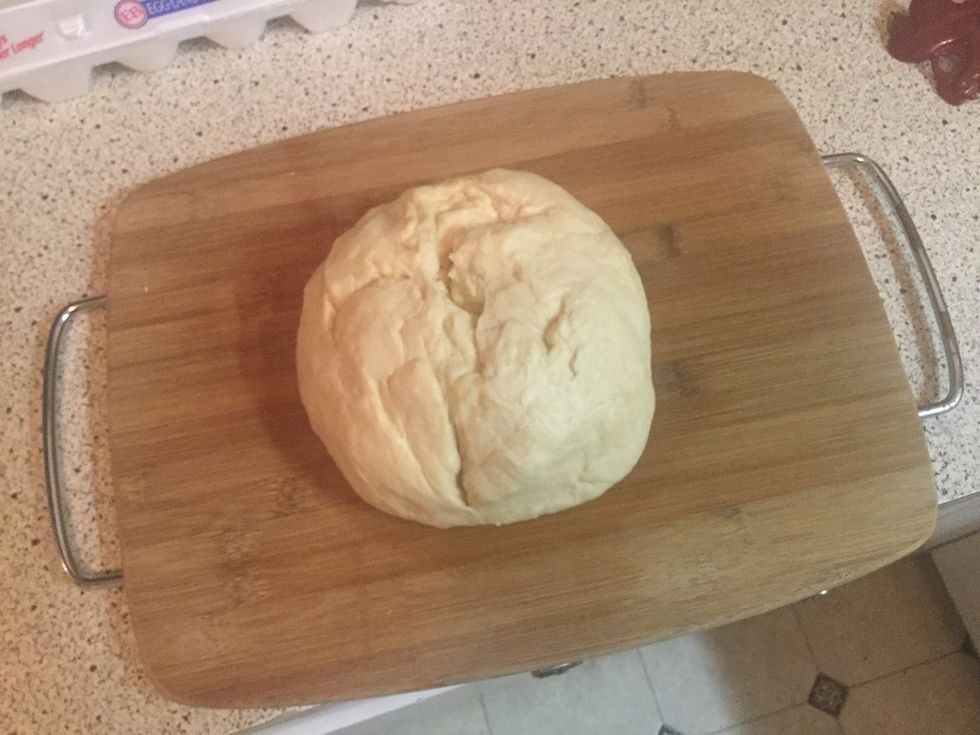 After mixing remove the dough and knead into a ball with your hands on a flat surface.(I used a cutting board, but any flat surface is fine.)