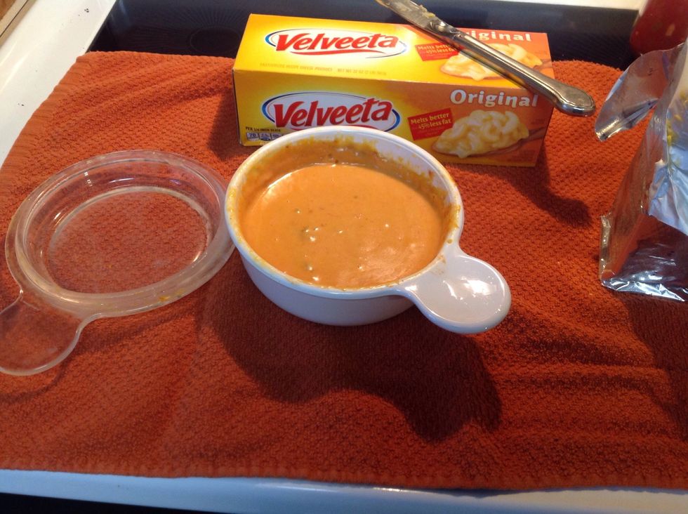 After mixing the dip, replace the lid and set the microwave for 30 seconds. (Repeat this until the dip looks similar to the image above)