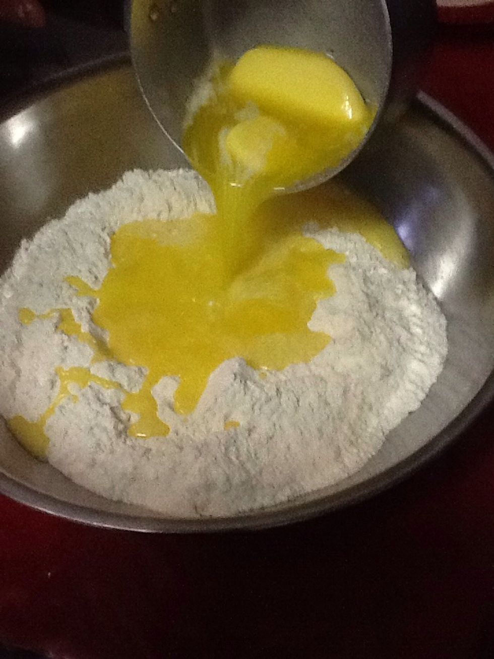 After mixing the sugar and flour, add the melted butter to the mixture