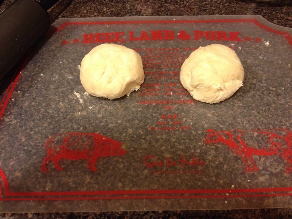 After mixing, you'll have 1 big ball of mix. Separate into two halves, one for each crust.