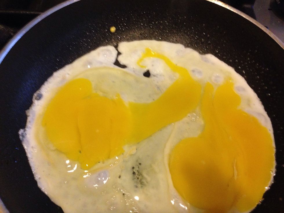 After my prep work is completed, I heat a small frying pan on Medium-high heat. Once the pan is hot enough, I crack 1-2 eggs and brake the yokes. I flip the eggs when I see bubbles form on the eggs.
