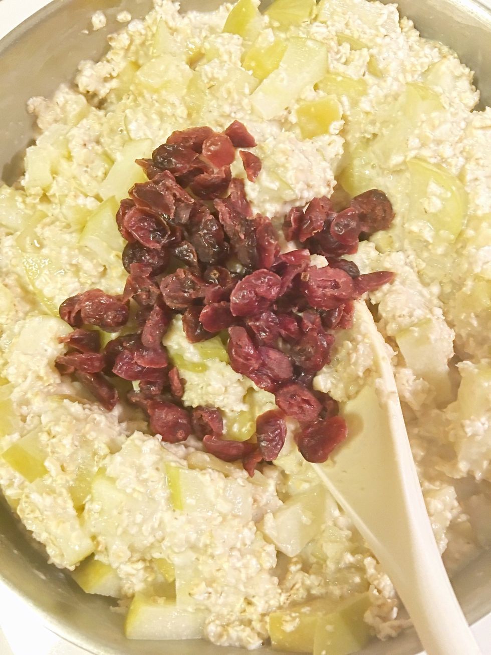 After oats and apples are cooked, combine. Then add cranberries.