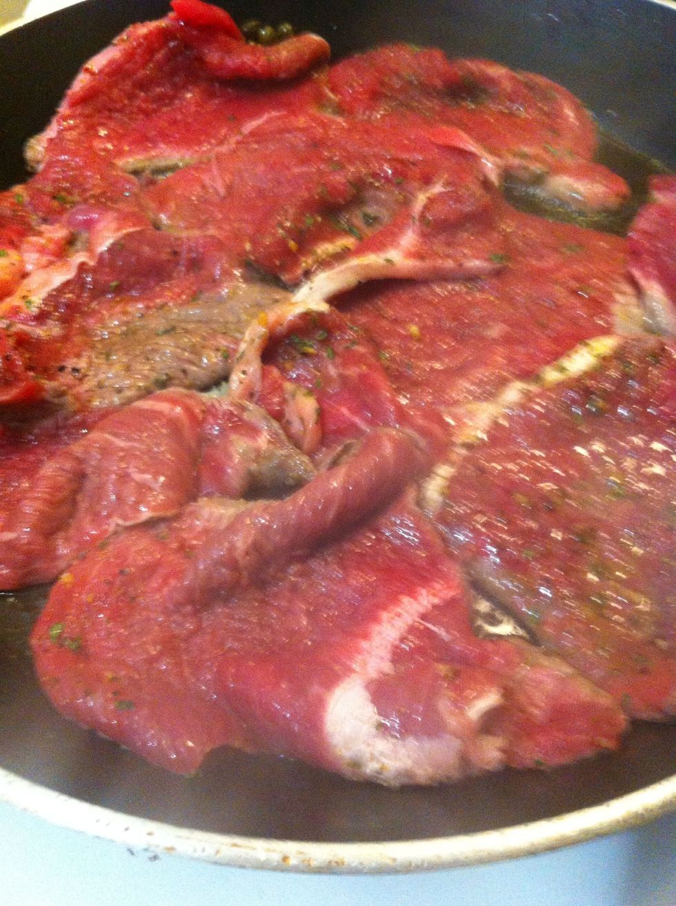 After olive oil is well-heated, place your meat flat in the pan (it's ok if it's bunched up, just make sure none of it is folded over so it all cooks evenly)