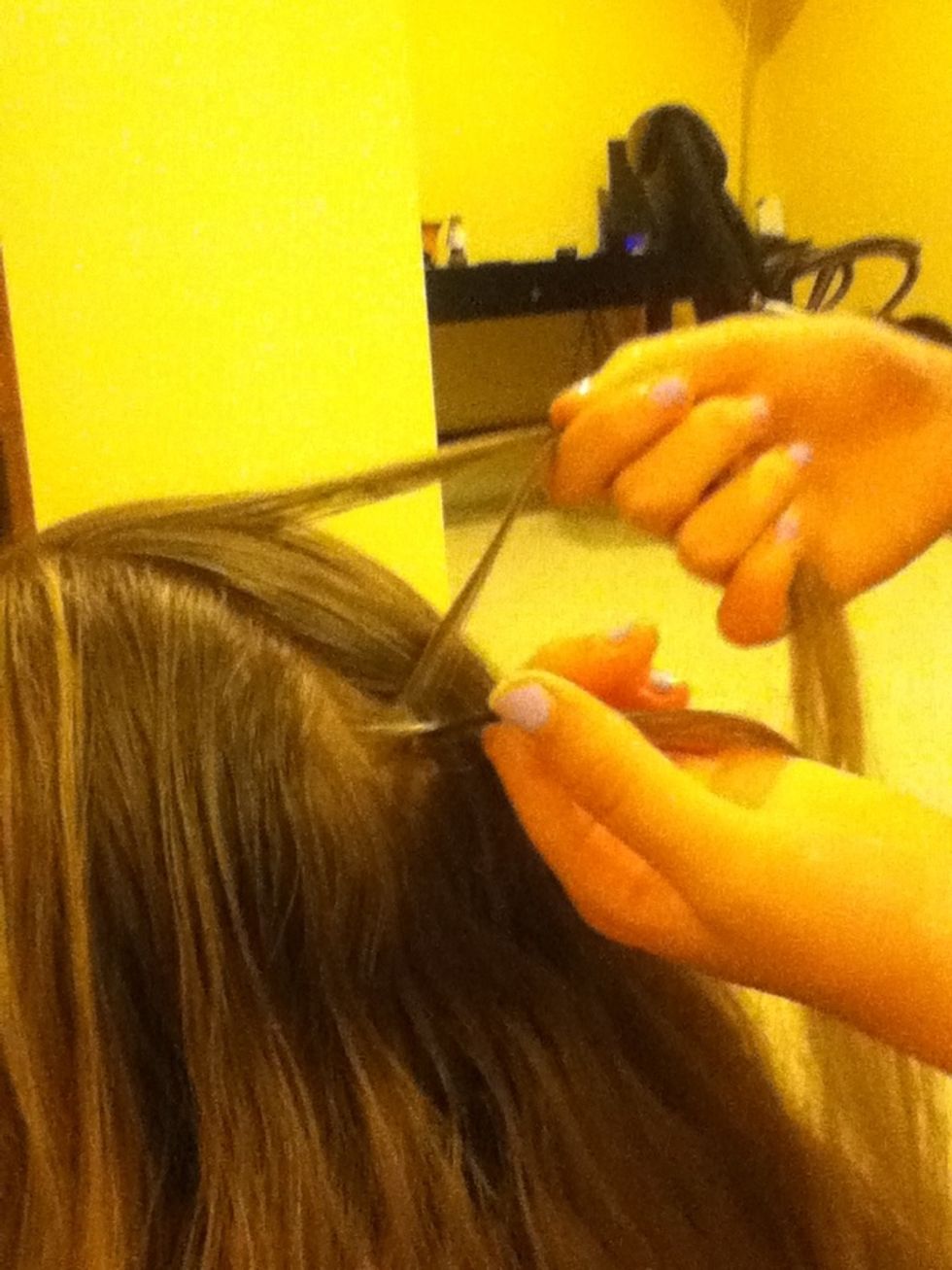 After one braid set grab the right piece of hair and add a piece of hair from that side to the piece