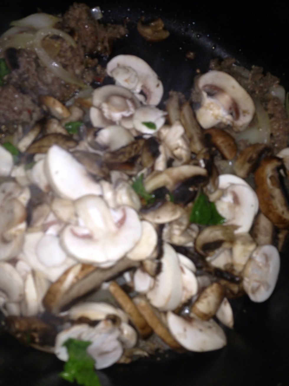 After onion and sausage cooked, add mushroom until it tender.