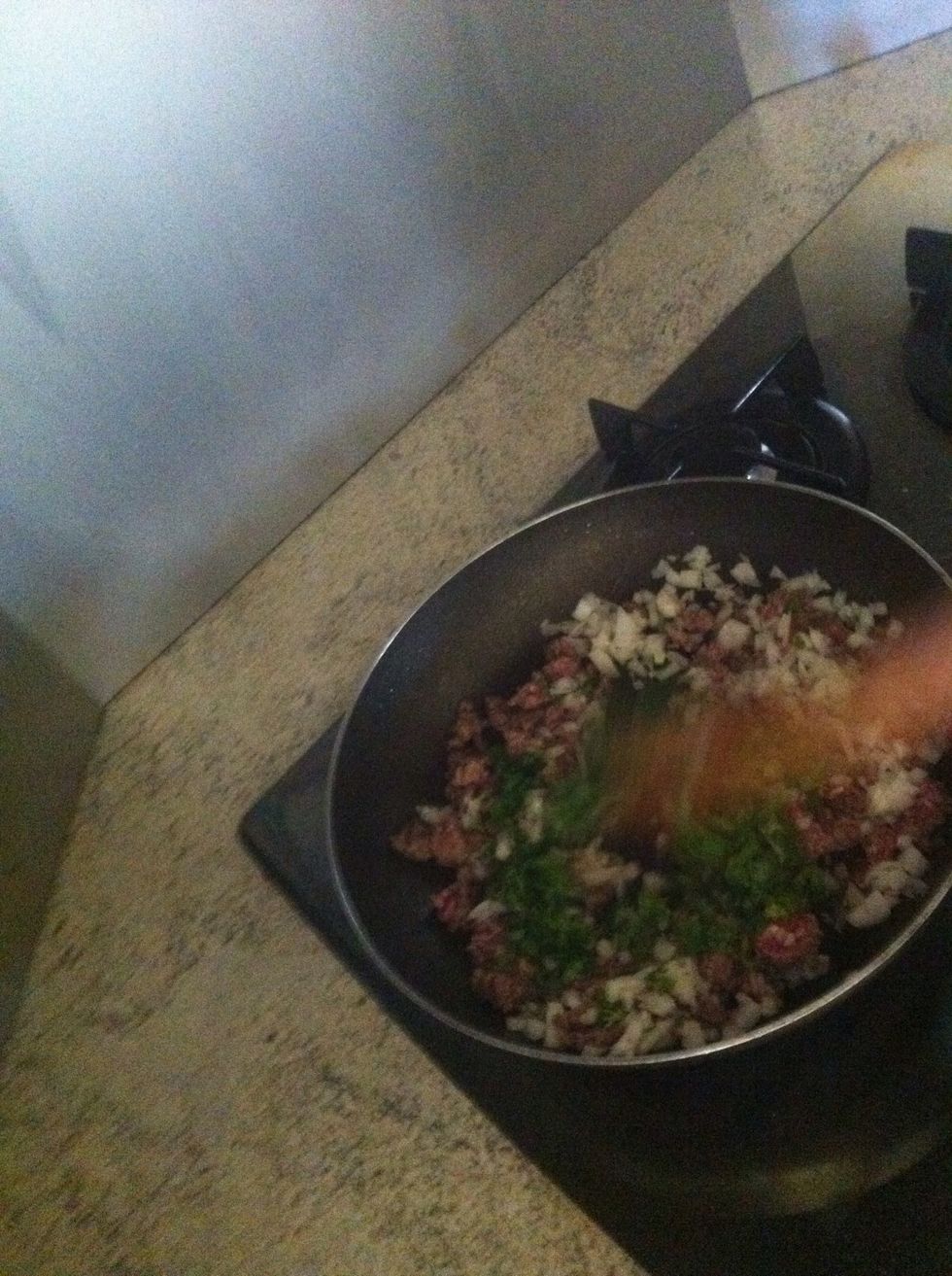 After onions are cooked a little add in parsley