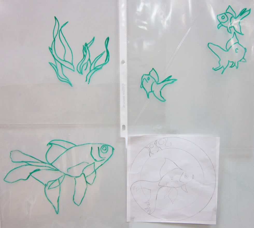 After outlining the desired objects and shapes, remove the photos and use only the shape outlines to help you combine them into one single drawing composition.  Tracing at this stage is not allowed.