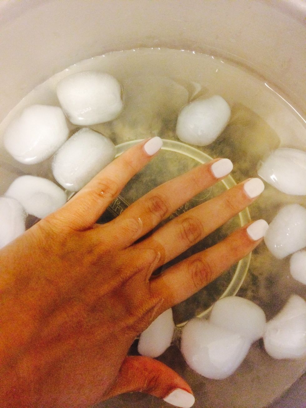 After painting your nails & applying top coat, wait 1 minute and then dunk your hand into ice cold water (one at a time).