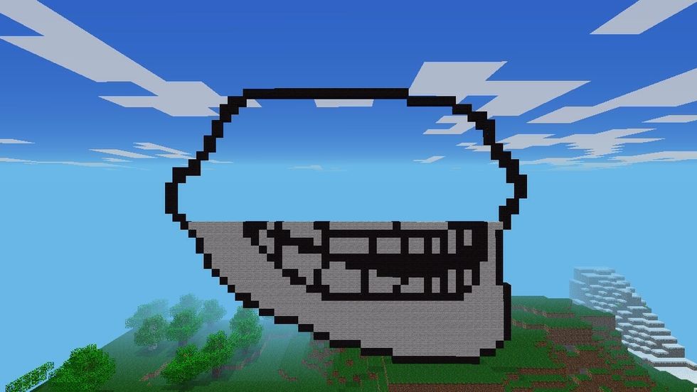 After part 2, you were left with this. The mouth and outline of the troll face In this part, you will be placing blocks to create the eyes and then your troll face will be completed.