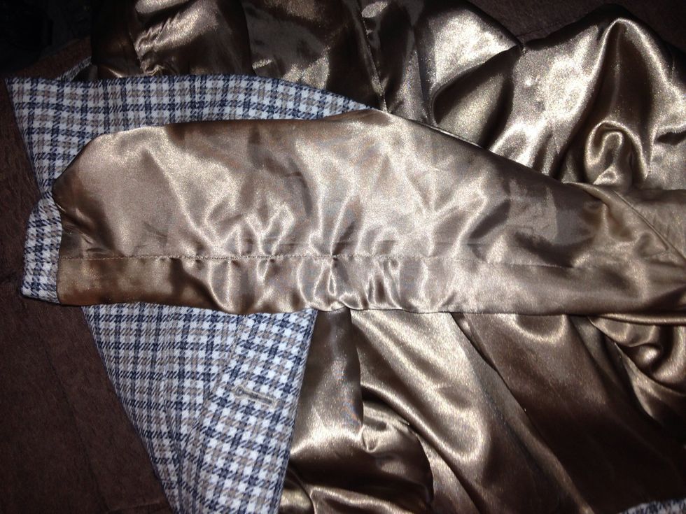 After pinning the patches on( i had help with this bit!) i opened the lining of the sleeves nearest to where I positioned the patches and all around the cuff, leaving the sleeve empty.