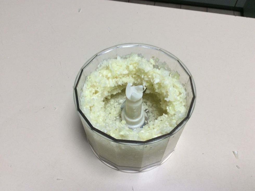 After placing diced onion and cabbage in food processor and blending it should look like this.
