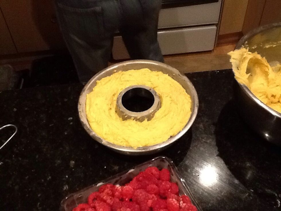 After placing raspberries on the bottom add dough then put in oven for 30 - 40 mins